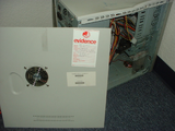 A smashed up desktop PC with an evidence sticker on it