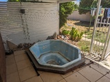 In-ground “hot tub”/spa bath on our back patio, devoid of water