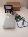 Greaseweazle Floppy Disk Controller, with a 3.5" Floppy Drive and some disks