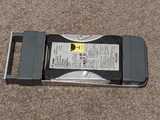 A Seagate hard disk, roughly 40GB with a PATA interface, crammed into an X-serve disk caddy, with the front handle extended